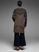 Tufted double knit coat, brown with navy geometric pattern on collar, shoulders, and sleeves.