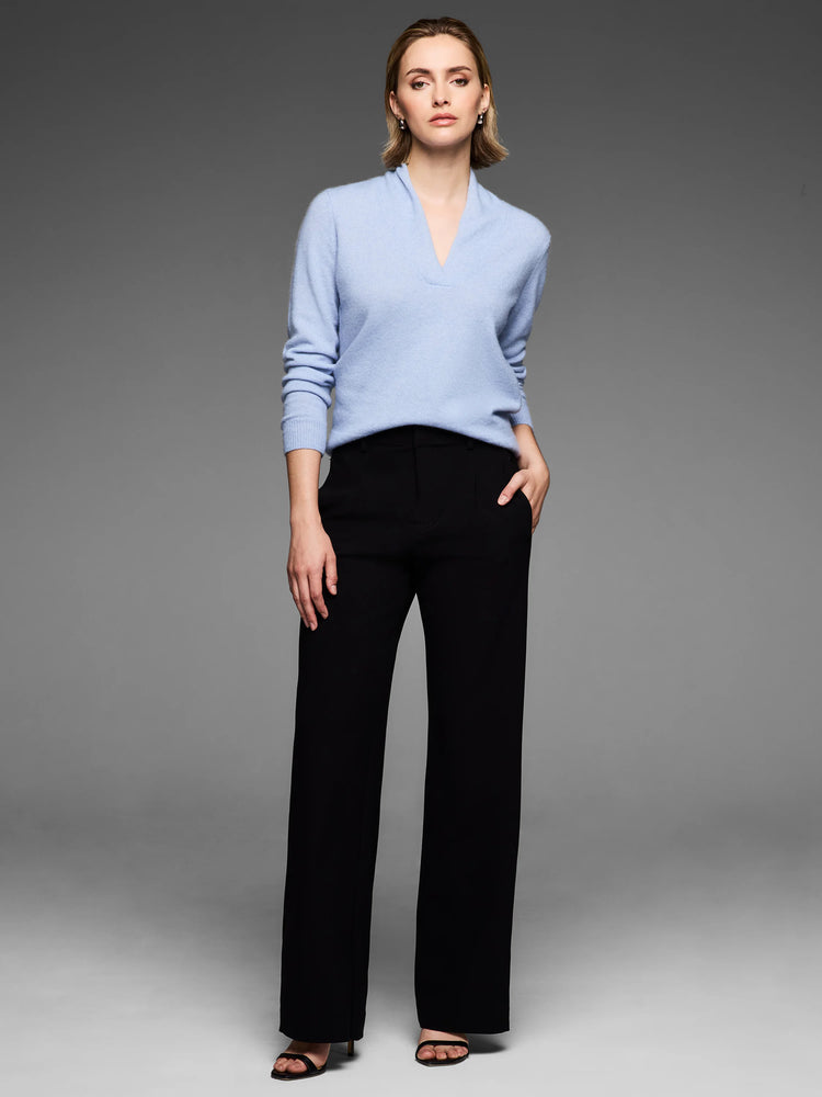Light blue cashmere sweater featuring a built-up V-neck and long sleeves with ribbed cuffs.