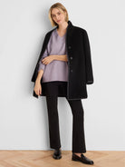 Light purple V-neck sweater with a fine knit texture.