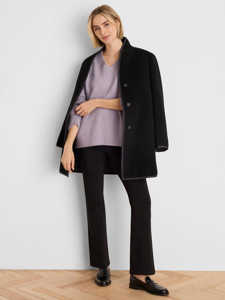 Light purple V-neck sweater with a fine knit texture.