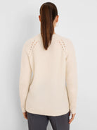 Off-white fuzzy sweater, shown from the back. Features a crew neck and delicate open-knit details along the shoulders.