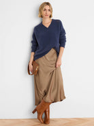 Navy V-neck sweater, soft, fuzzy knit, with small eyelets on shoulders.