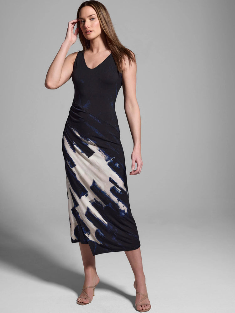 Black sleeveless midi dress with an abstract print in shades of off-white and dark blue.  Ruched detail at waist.