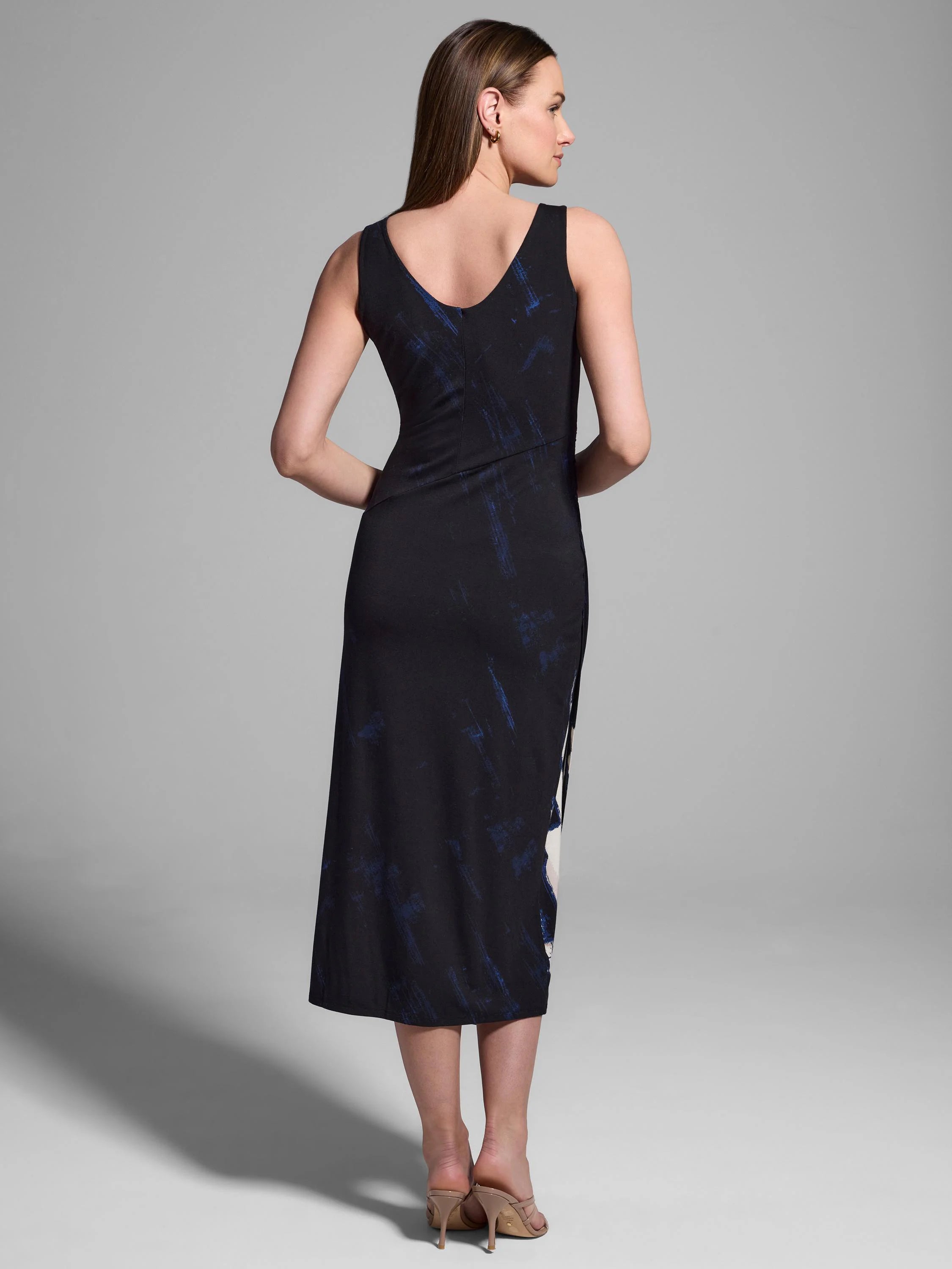 Black midi dress with blue and white abstract brushstrokes. Sleeveless, ruched bodice, and side slit.