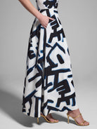 White midi skirt with a navy and black abstract print.  Features pockets.