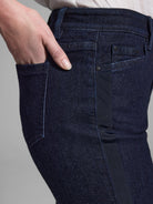 Dark wash denim jeans with a dark navy ribbon detail down the side.
