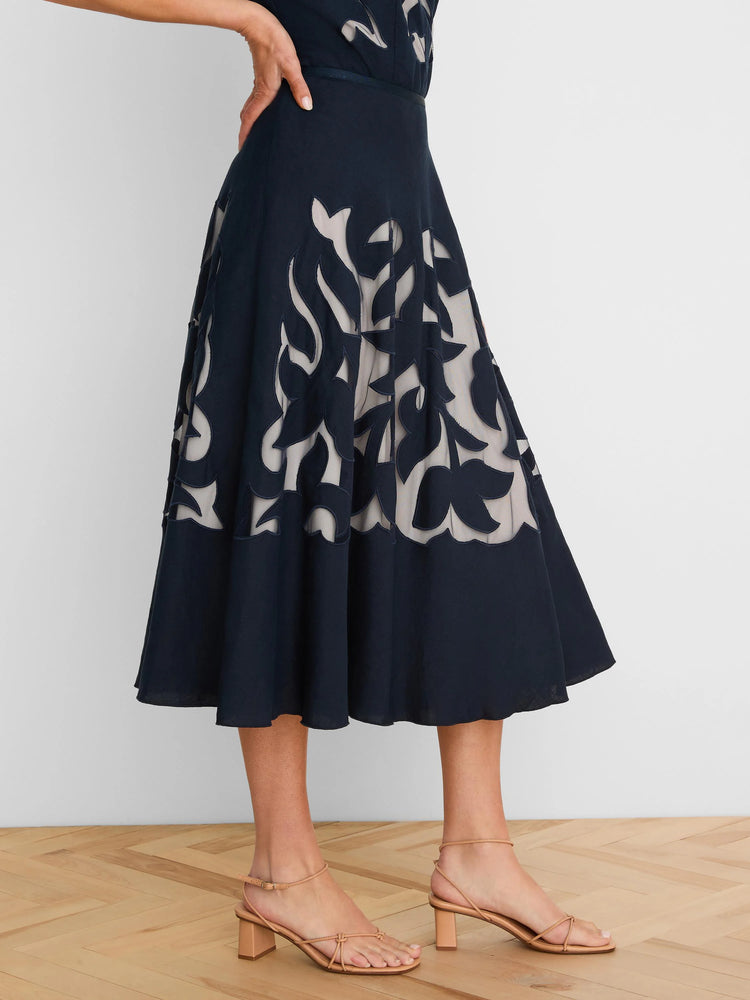 Navy midi skirt with beige-backed floral cut-outs.