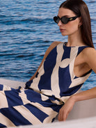 Sleeveless cream & navy blue dress with a bold, abstract geometric pattern.