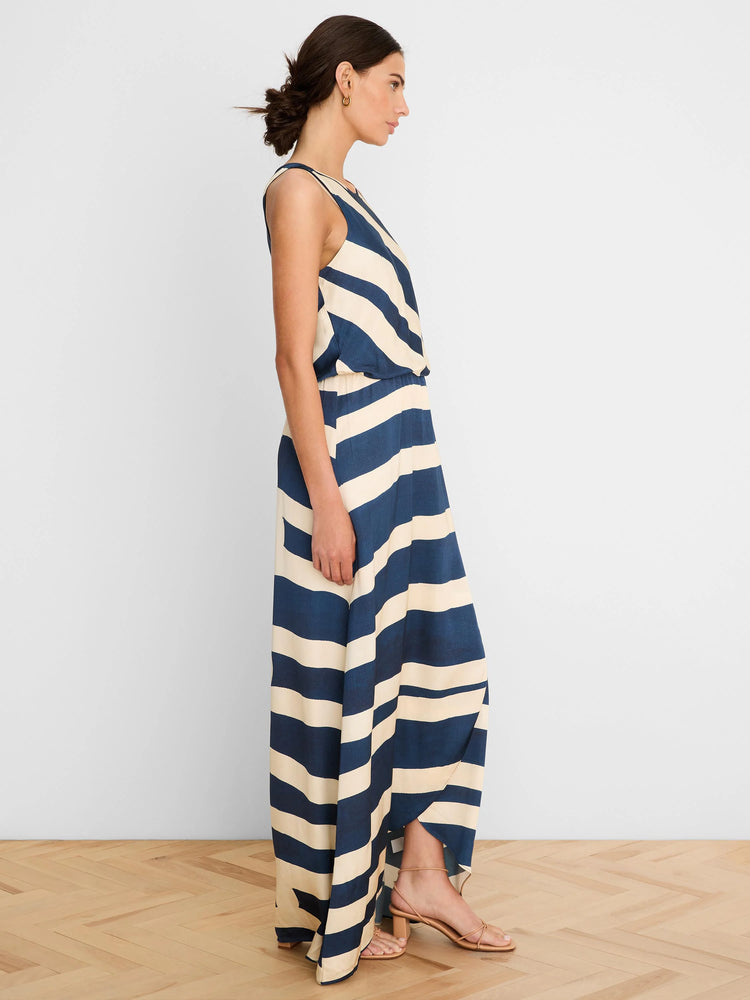 Sleeveless navy and cream striped maxi dress with an elasticated waist and a high-low hem.