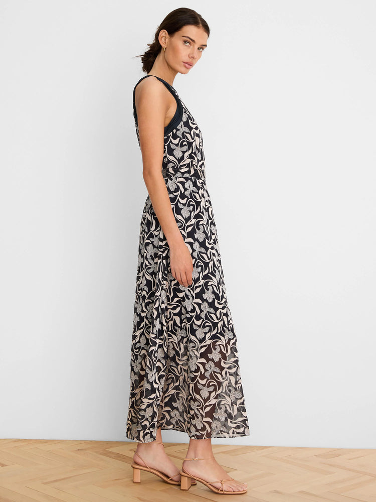 Dark navy sleeveless maxi dress with semi-sheer cream floral burnout pattern.