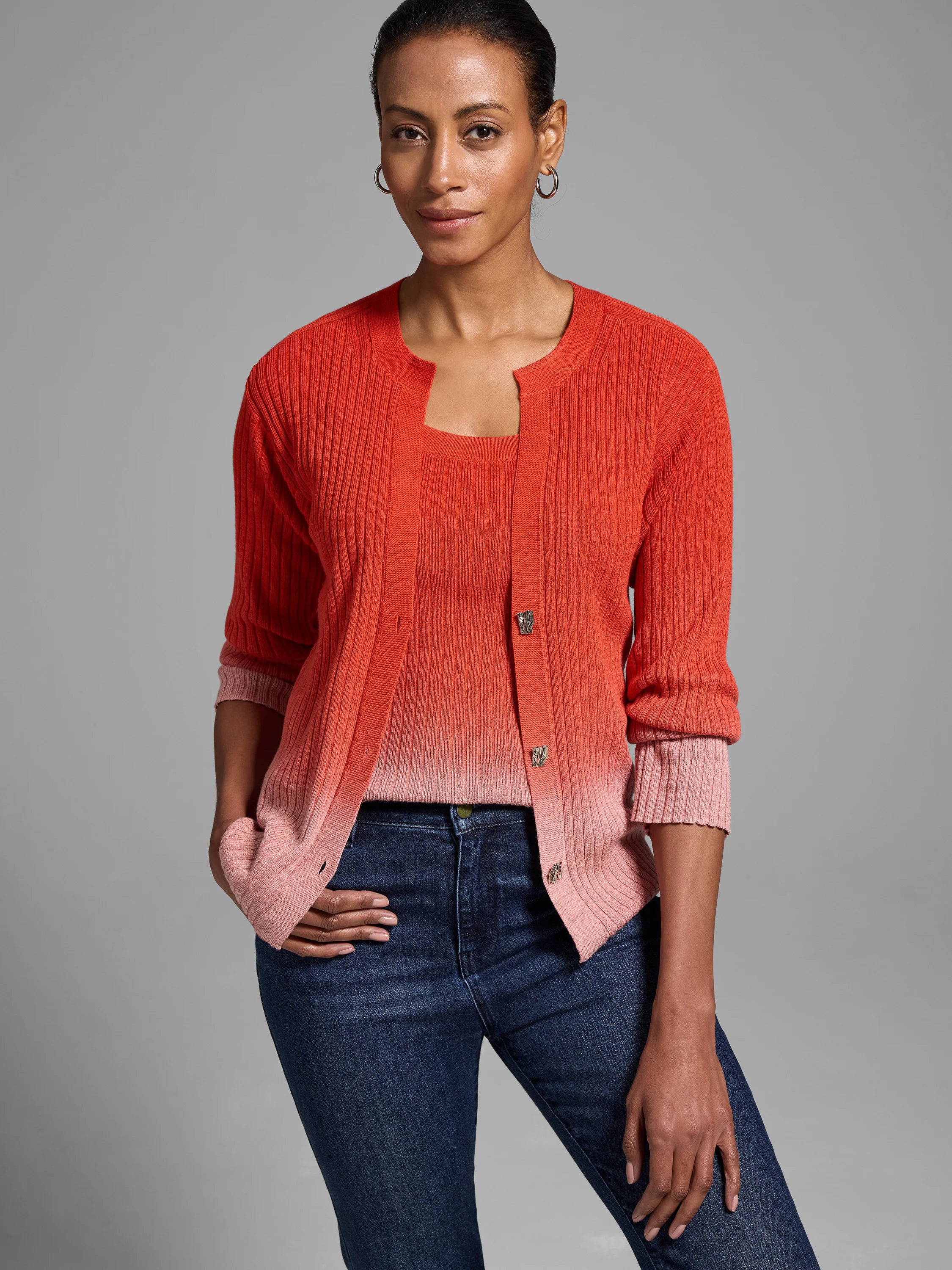 Ombre knit cardigan; coral to light pink, ribbed texture, three-quarter sleeves, button front.