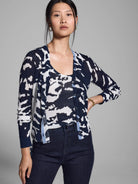Navy blue and white abstract print cardigan, button front, long sleeves, ribbed knit.