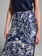 Silk midi skirt, navy blue and off-white floral pattern, elastic waistband, side slits.