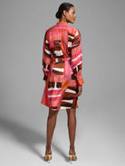 Shirtdress, knee-length, pink, brown, and white abstract print.  Elastic waist. Long sleeves, button cuffs.