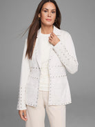 Off-white blazer with silver studs on lapels, front, and sleeves.