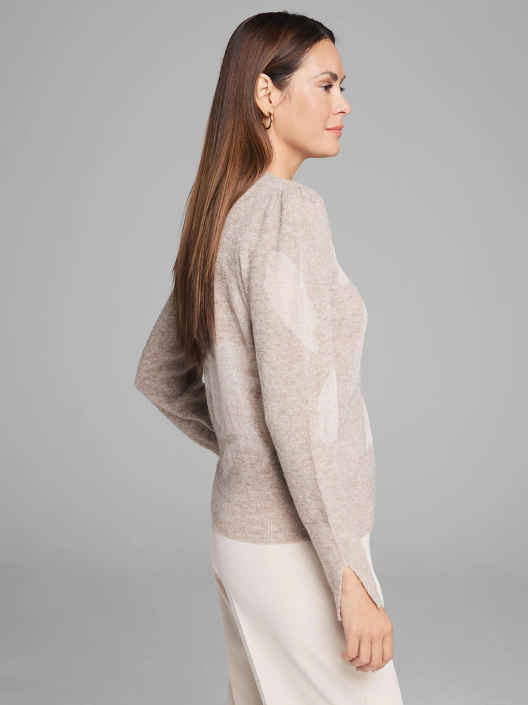 Light beige lace knit floral sweater with puffed shoulders and slit cuffs.