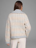 Knit jacket with cream, beige, & light gray houndstooth pattern. Features a textured medium gray collar & cuffs.
