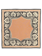 Square bandana: peach center, framed by intricate black, cream, and peach floral-scrollwork borders.
