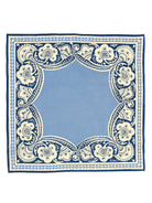 Square bandana. Sky blue center with a detailed navy blue & cream floral border.
