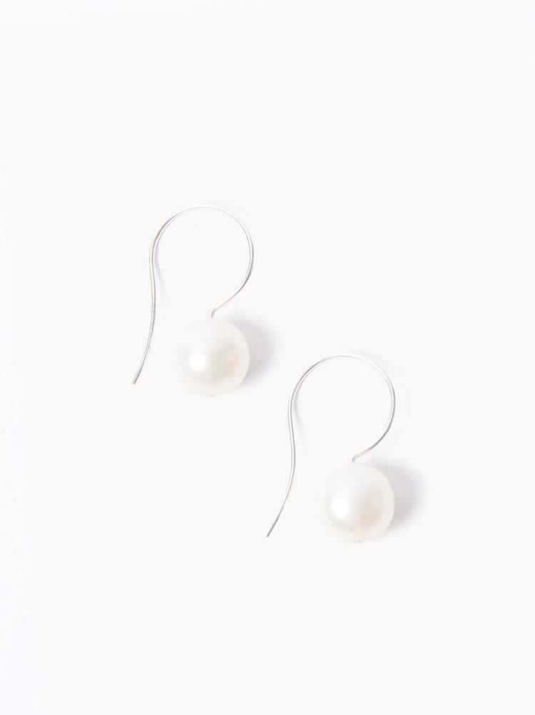 Pair of silver hook earrings, each with a single off-white pearl.