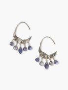 Silver crescent earrings with 5 dangling, faceted blue-purple iolite beads on each.