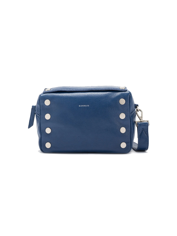 Dark blue pebbled leather crossbody bag with silver stud details on front and sides, and Hammitt logo.