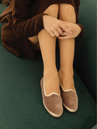 Taupe velvet slippers with wavy cream trim and braided espadrille sole.