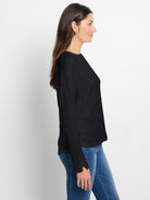 Black long-sleeve tee with round neck, subtle lace knit pattern, and cuff slit.