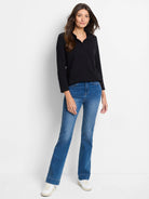 Black long-sleeve top with a ruffled stand-up collar and V-neck opening.