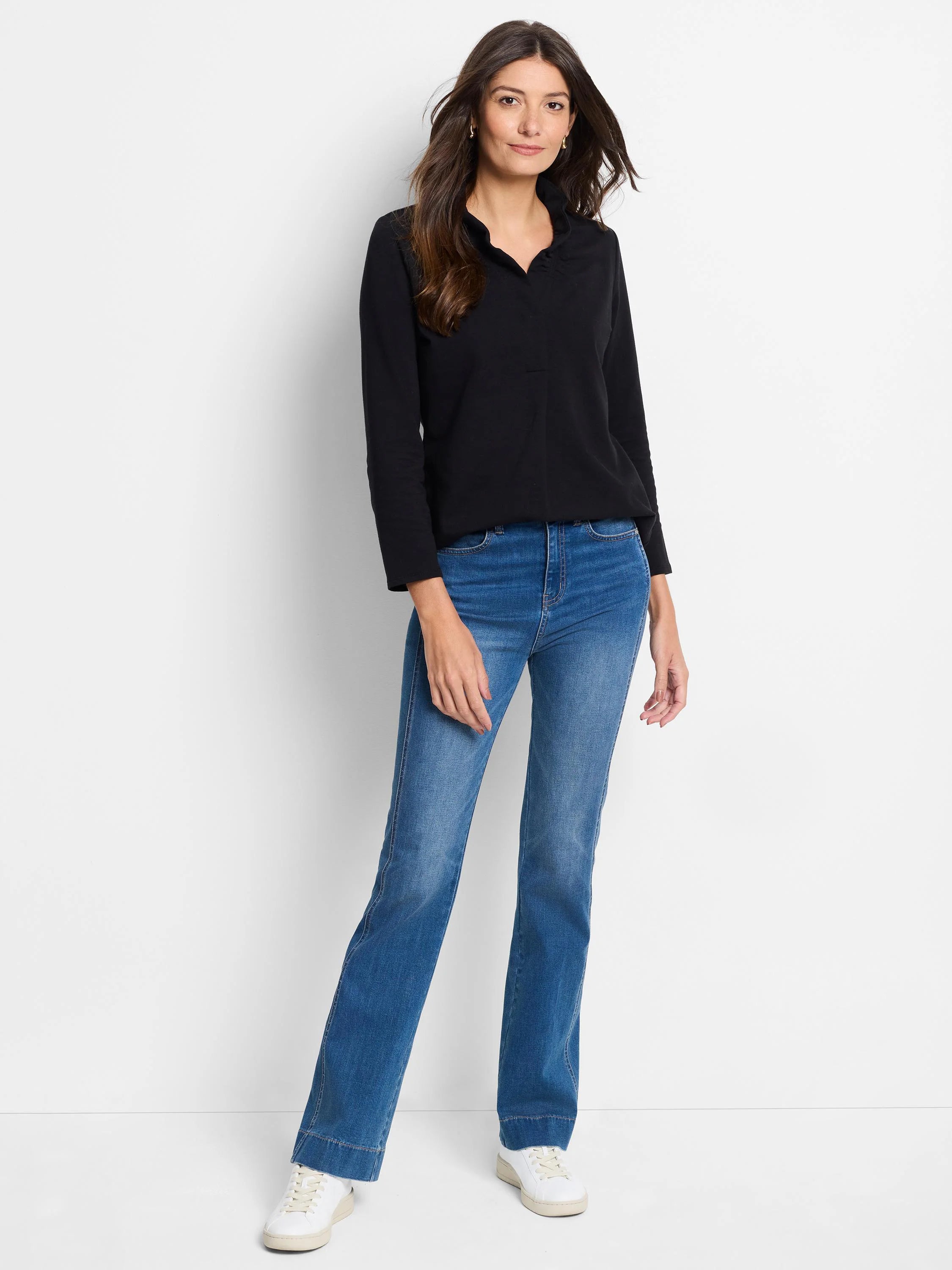 Black long-sleeve top with a ruffled stand-up collar and V-neck opening.