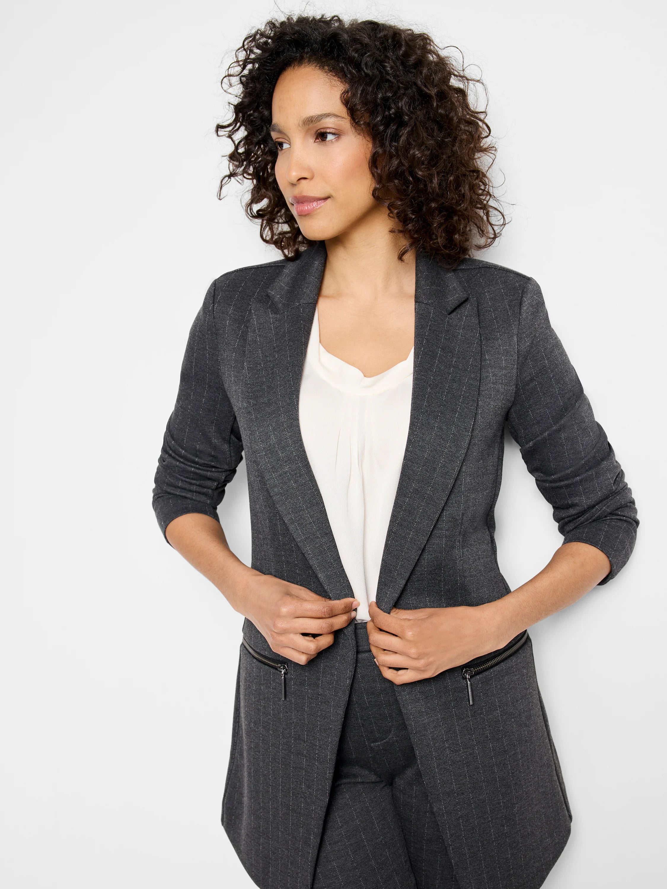 Dark gray knit jacket with thin white pinstripes, open front, lapels, and visible front zipper pockets.