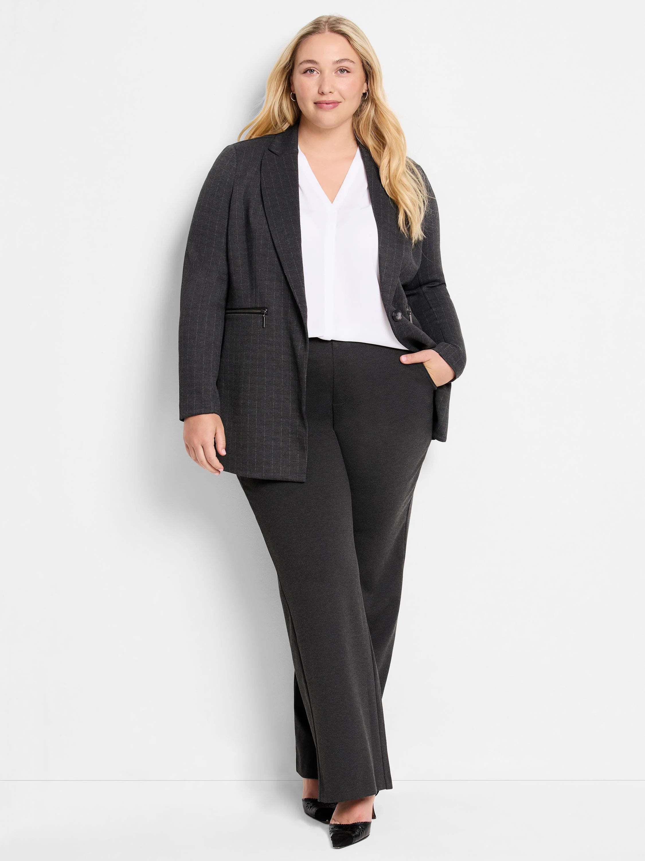 Dark gray knit pinstripe jacket, worn open, with a decorative zip pocket on the left.