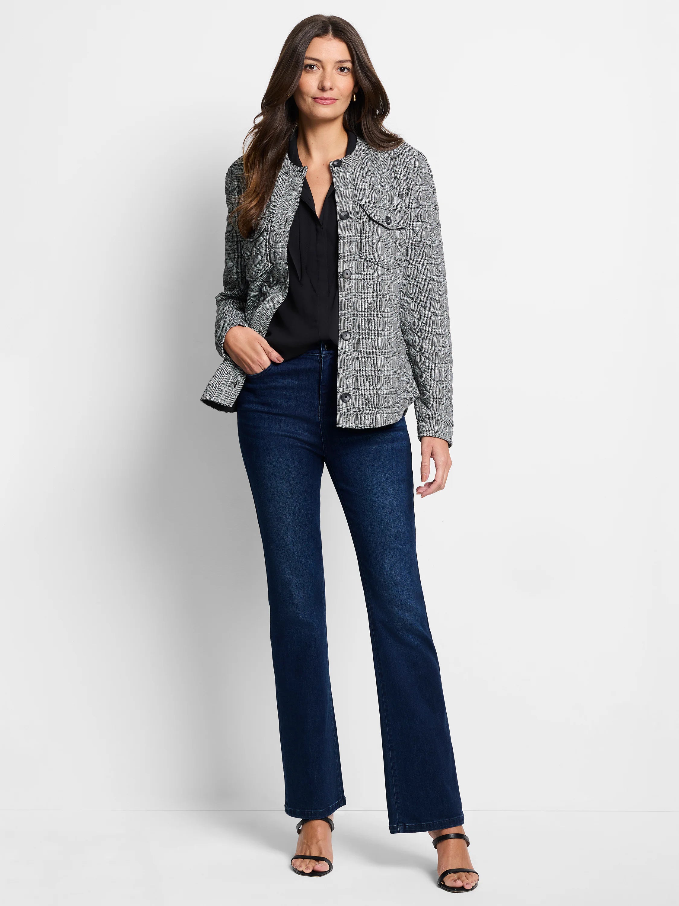 Quilted gray and white plaid jacket with dark buttons and two chest pockets.