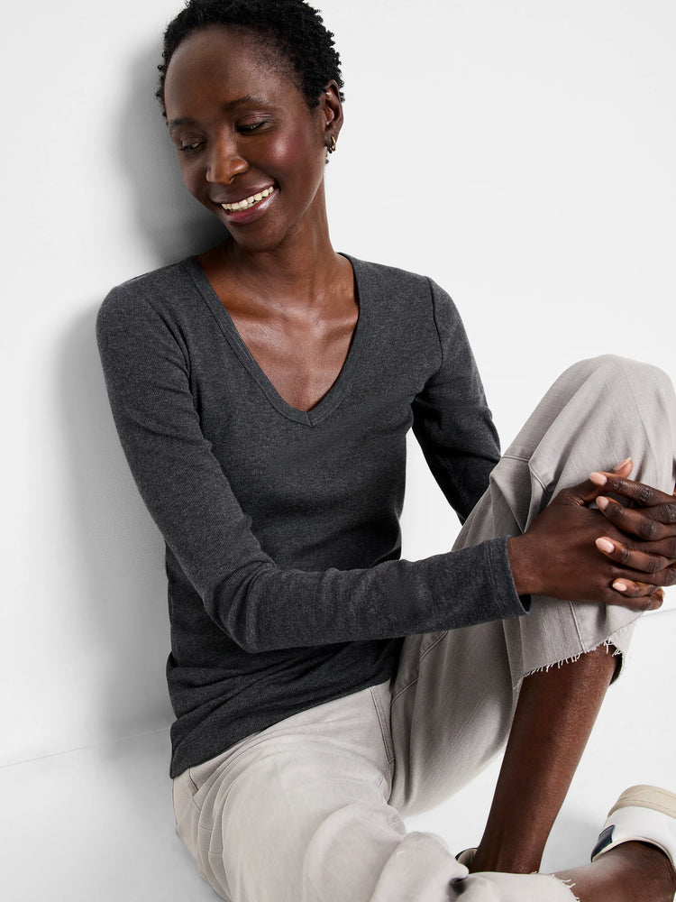 Charcoal gray ribbed knit long sleeve V-neck tee, close-fitting.