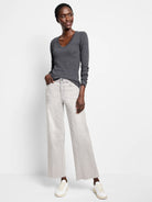 Dark grey V-neck long sleeve tee. Features a subtle, fine rib knit texture.