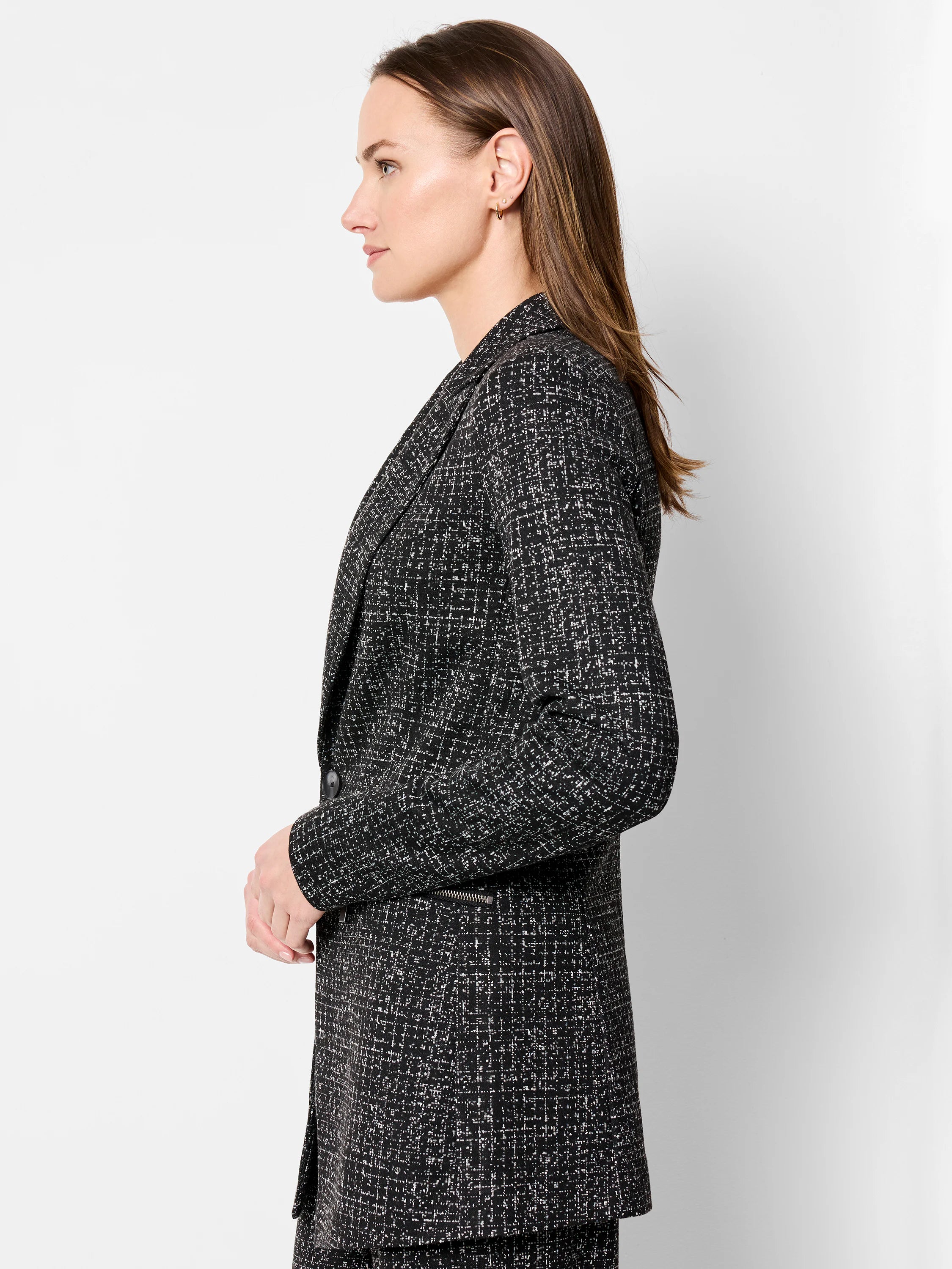 Black and white dotty grid knit jacket. Features lapels, a single button closure, and a visible zip detail.