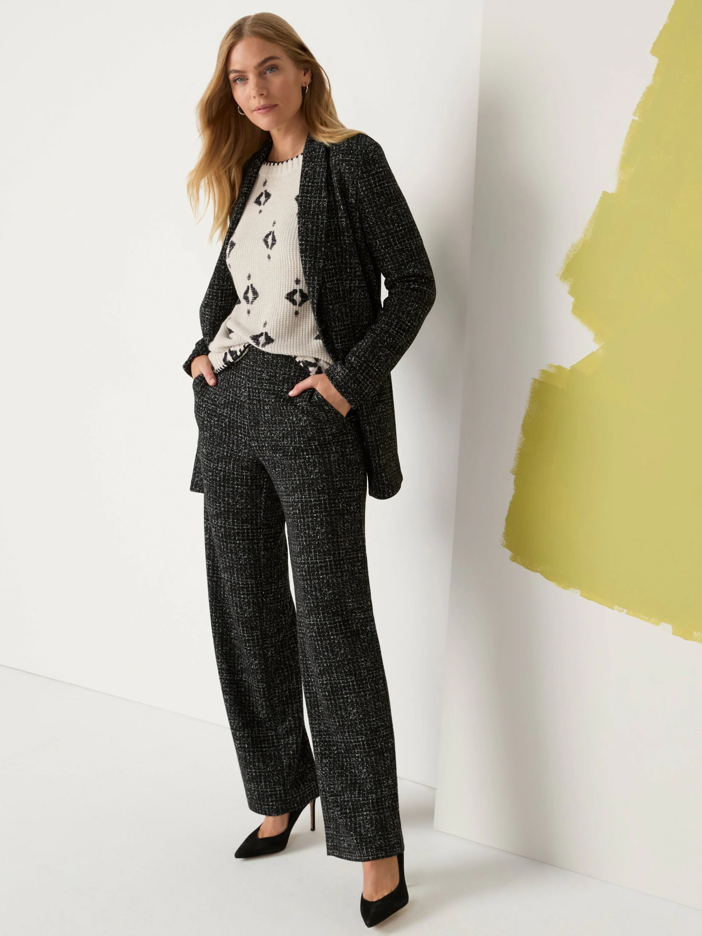 Black and white speckled grid-knit jacket, shown open.