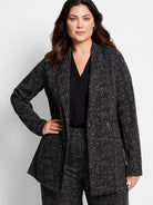 Black Dotty Grid knit jacket with white speckles, single button, and zipper pocket.