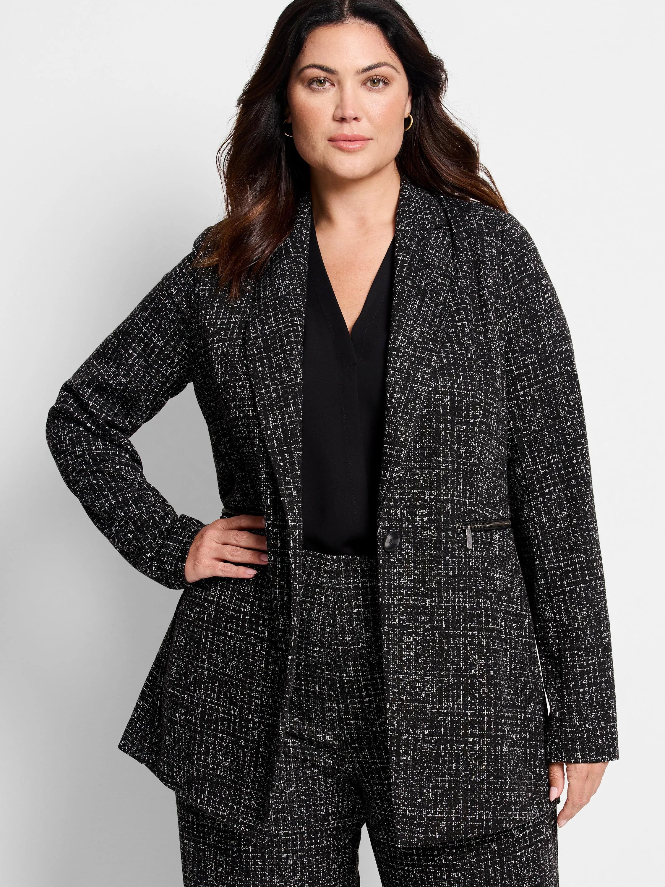 Black Dotty Grid knit jacket with white speckles, single button, and zipper pocket.