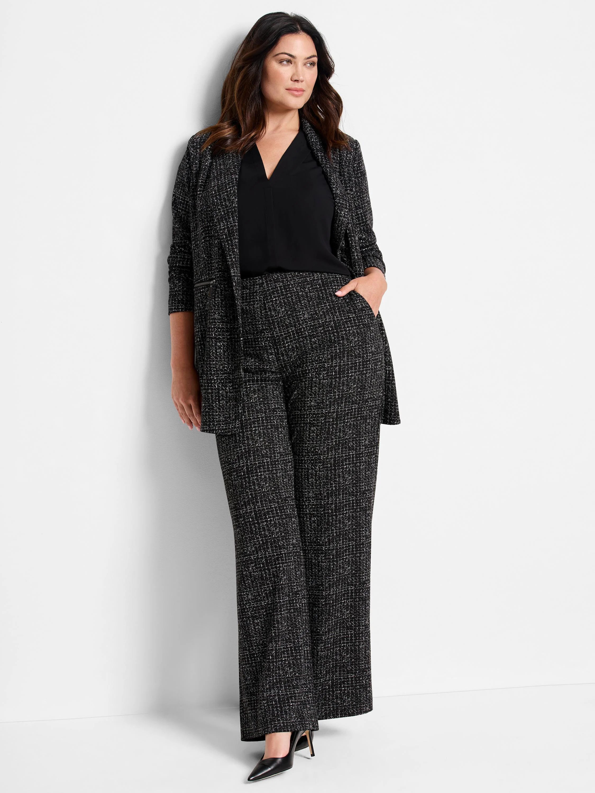 Black & white dotty grid knit zip jacket, shown as part of a matching set with wide-leg trousers.