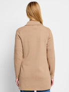 Tan jacket, seen from back. Features long raglan sleeves, a collar, knit texture, and mid-thigh length.
