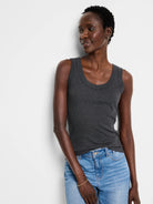 Fitted dark gray ribbed scoop neck tank. Shows prominent vertical knit texture.