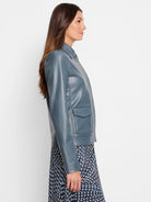 Dusty blue faux leather collared jacket with snap front and flap patch pockets.