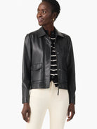 Black faux leather jacket with a collar, zip front, and two flap chest pockets.