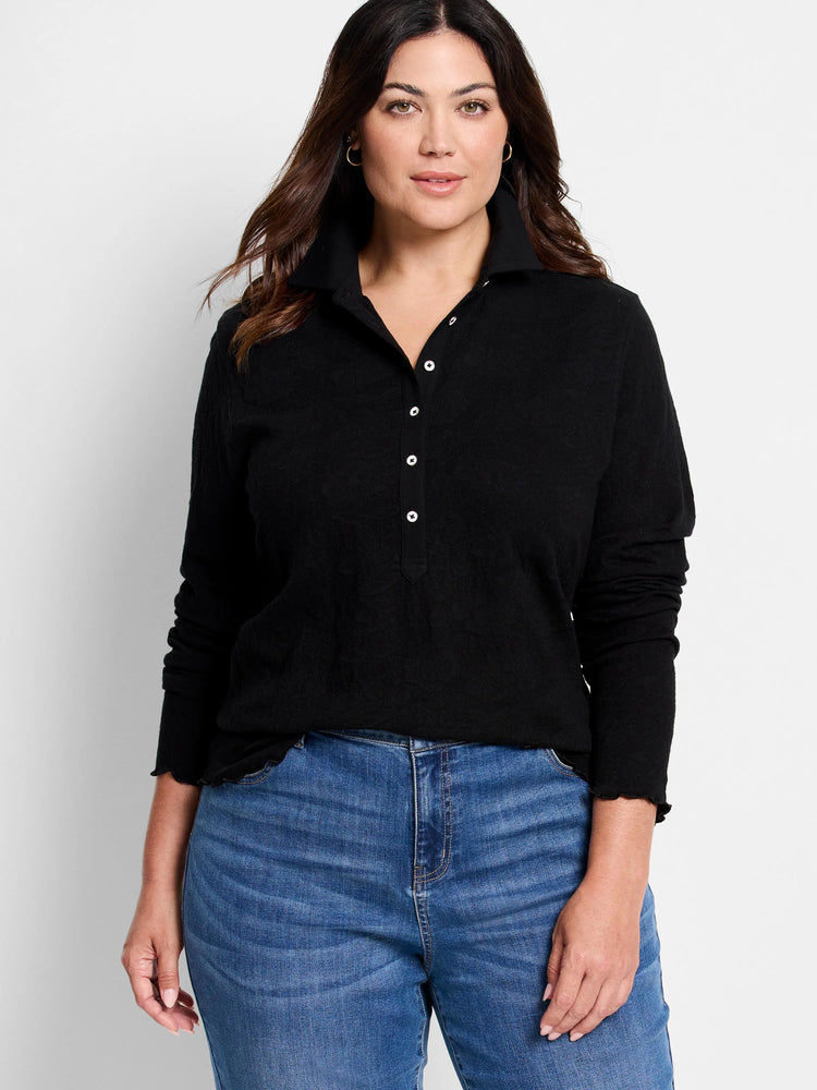 Black lace knit collared top with a Henley placket, white buttons, long sleeves, and ruffled trim.
