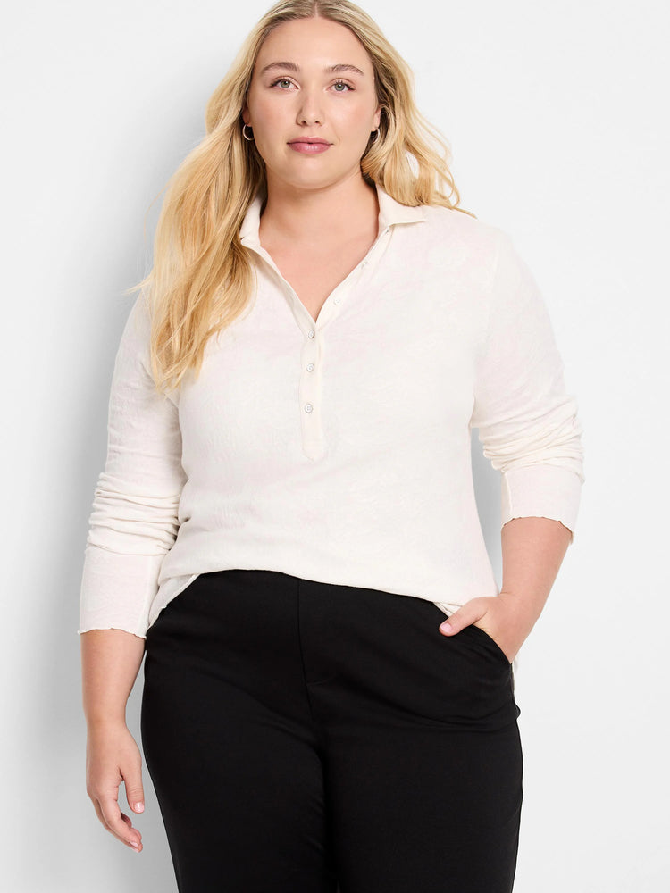 Off-white lace knit collared top with long sleeves and partial button placket.