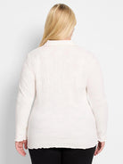 Off-white lace knit collared top, back view, with long sleeves, scalloped cuffs and hem.