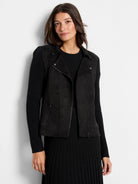 Black mixed media moto jacket with faux suede body, knit sleeves, asymmetrical zipper, and lapel snaps.