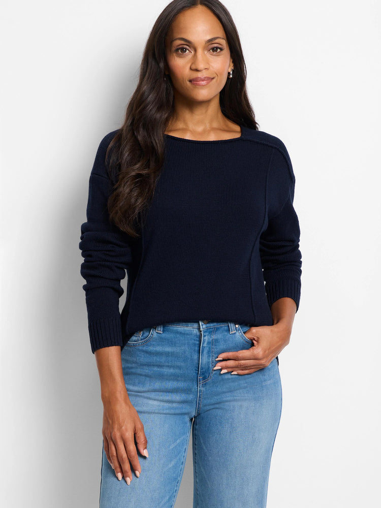 Dark navy boat neck sweater with visible seam details on shoulders & sides, and ribbed cuffs.