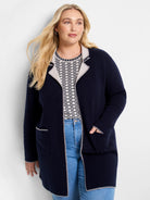 Navy knit jacket with light grey scalloped trim on lapels, front, pockets, cuffs, and hem.